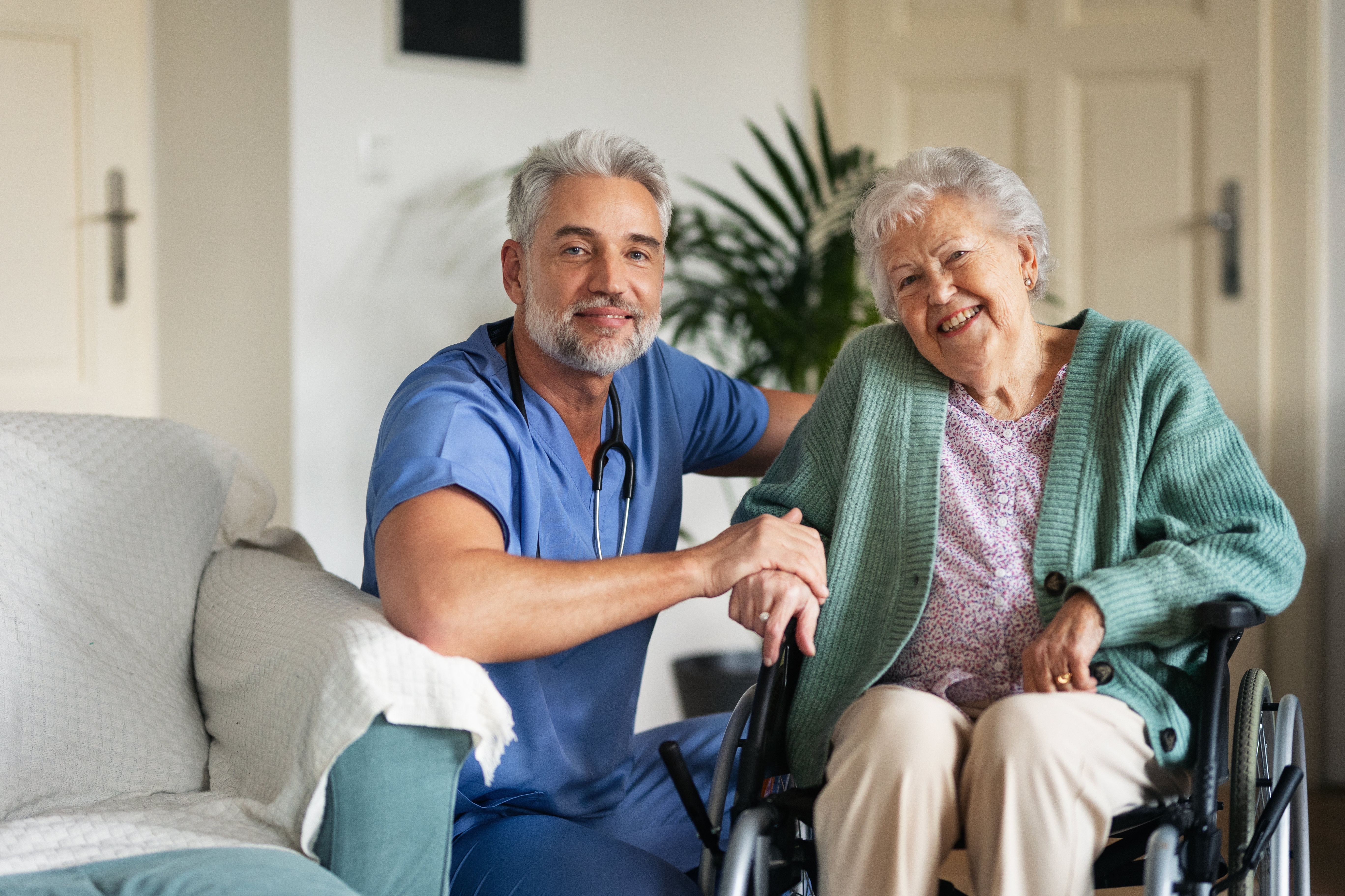 Caregiver doing regular check-up of senior woman in her home