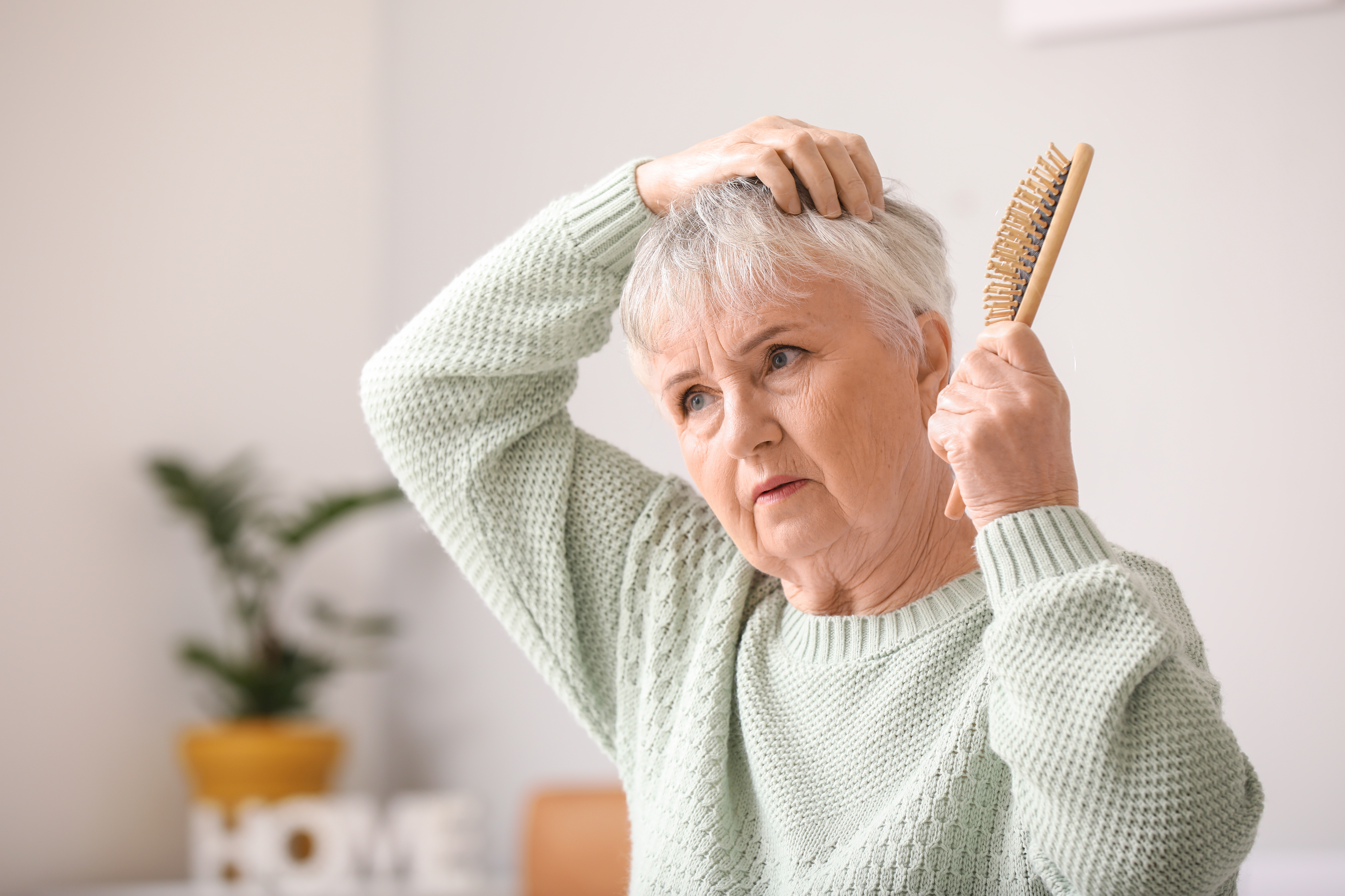 female senior brushing her hair