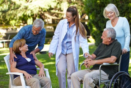 Many seniors relaxing in a park