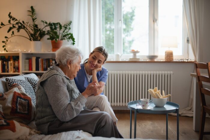 Caregiver providing specialized in-home care for a senior