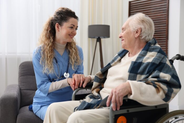 Caregiver assisting senior returning home after a hospital stay